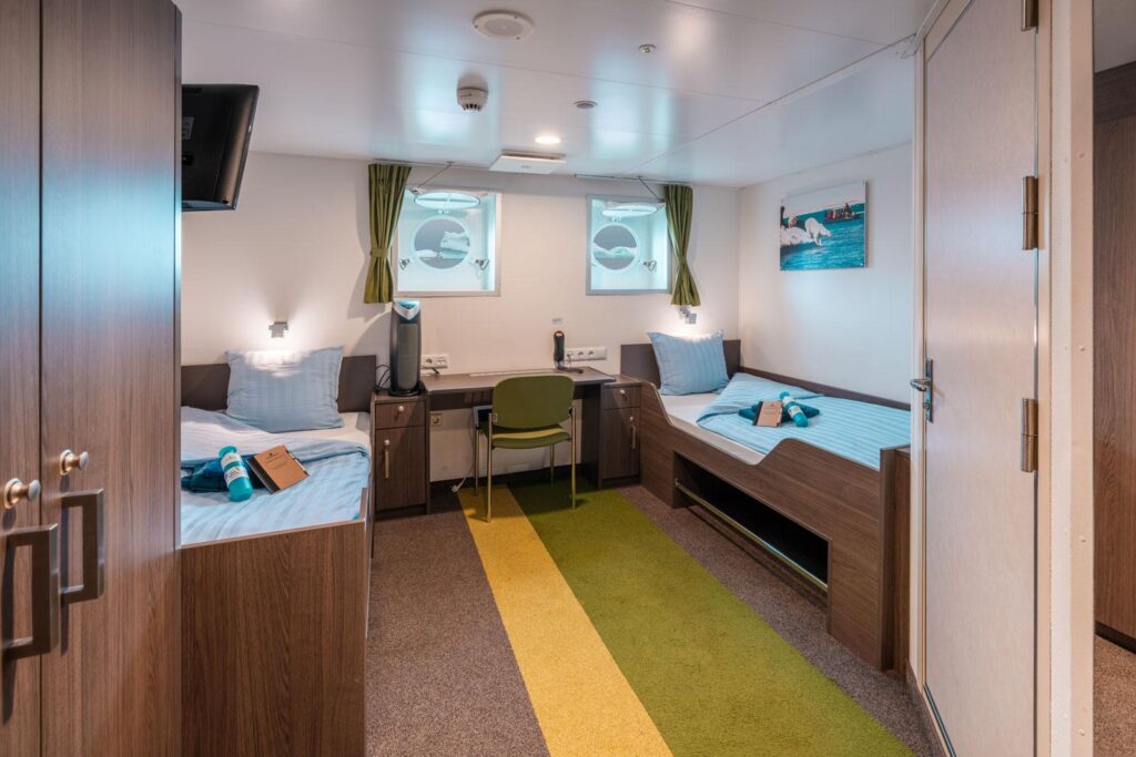 Ortelius twin porthole cabin